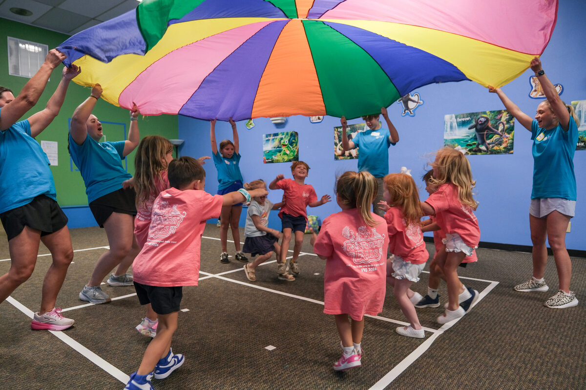 Children playing with a parachute at church