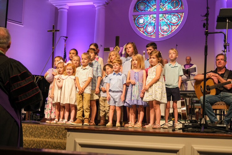 The children's choir singing in the sanctuary