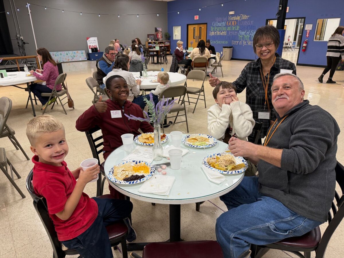 Neighbors sharing a meal at the Community Dinner