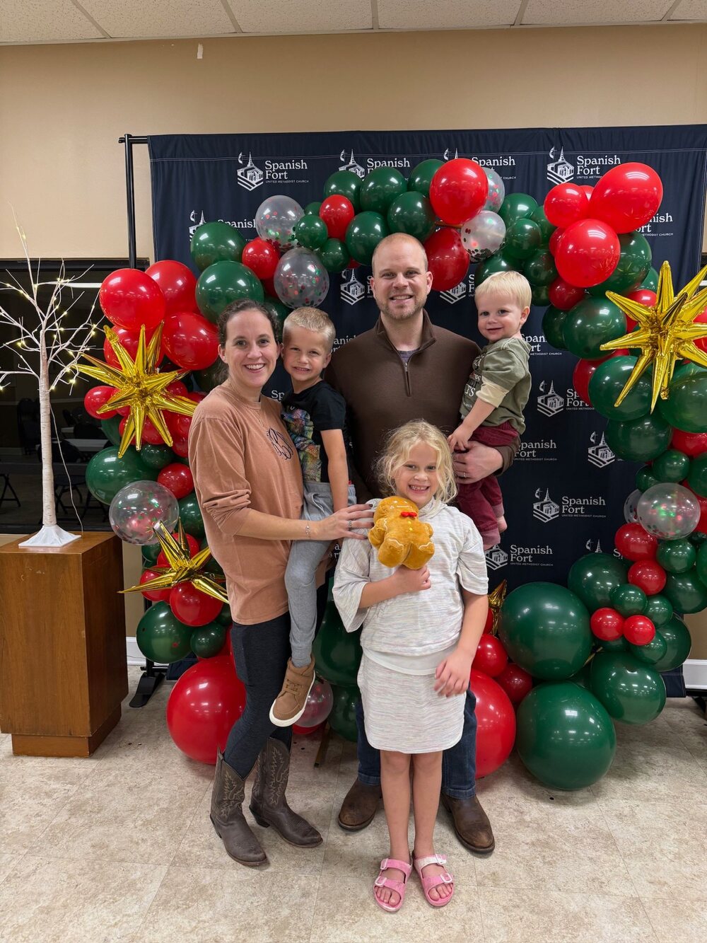 A young family at the churchwide Christmas reception