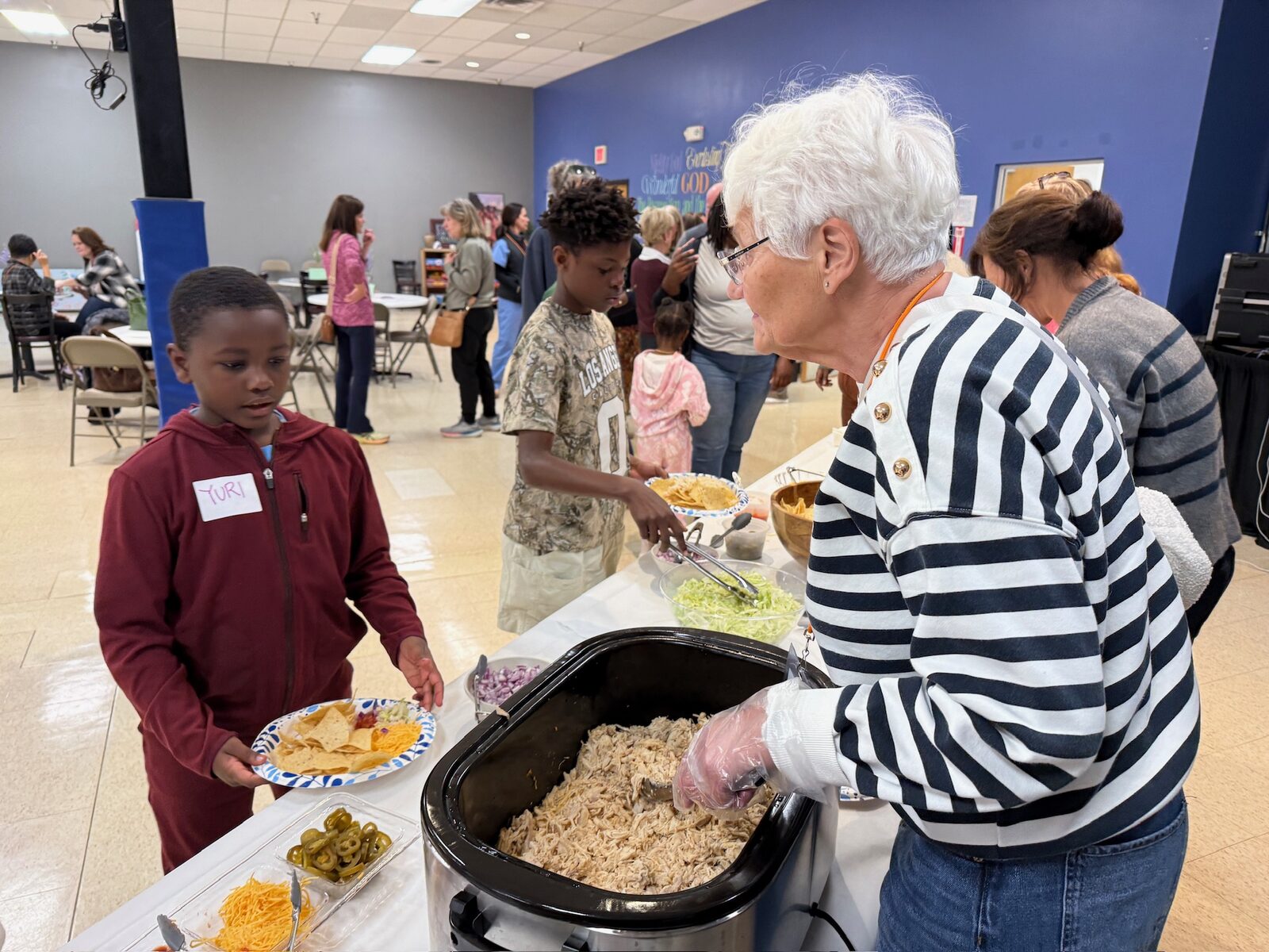 Serving a warm meal at the Community Dinner