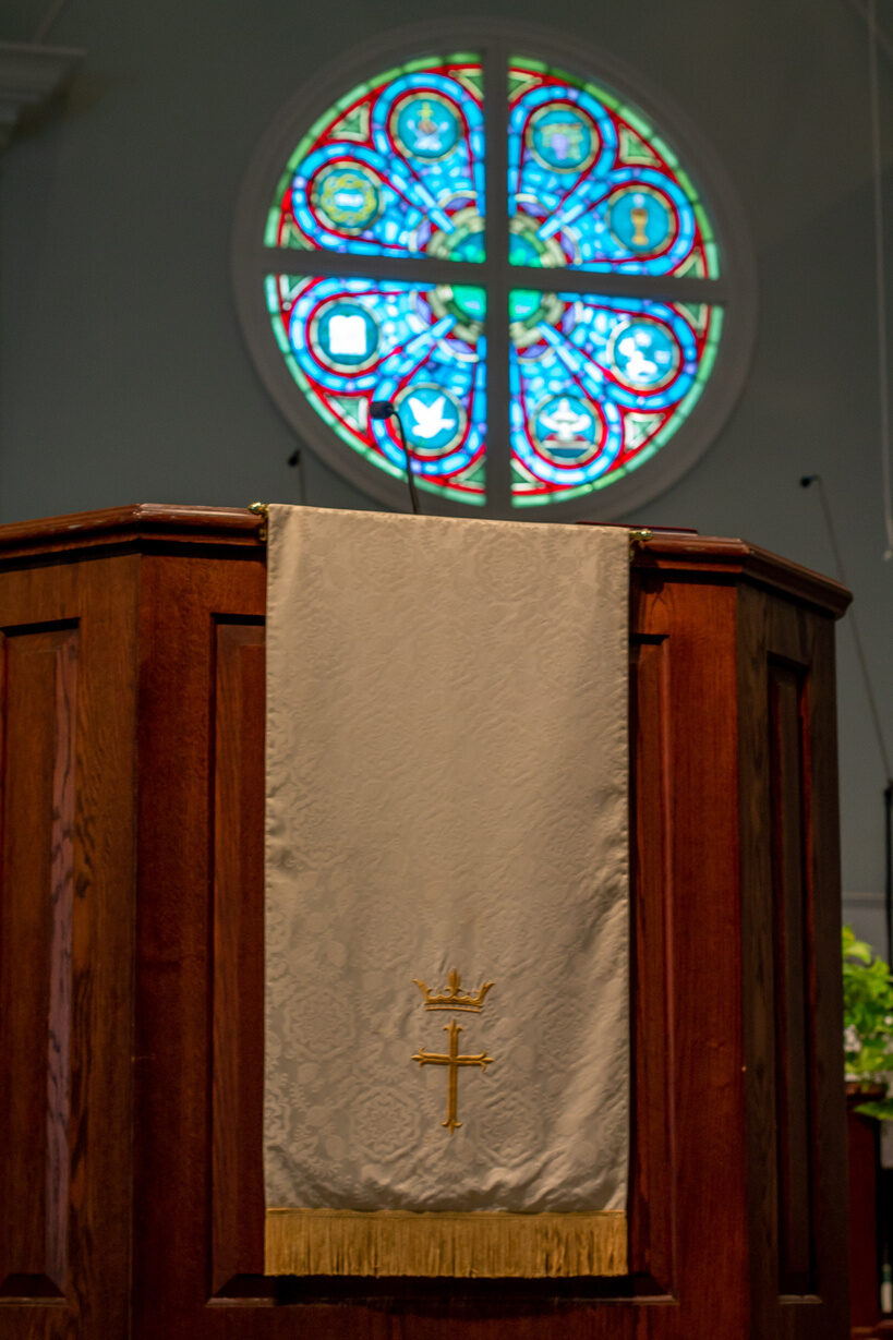 The rose window and pulpit of the sanctuary