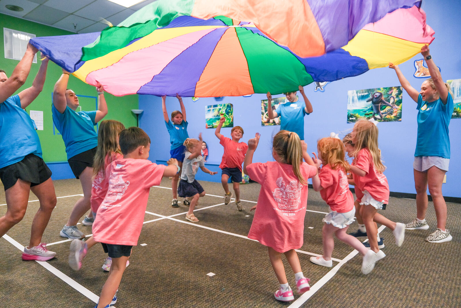 Children playing under a parachute at Vacation Bible School at Spanish Fort UMC